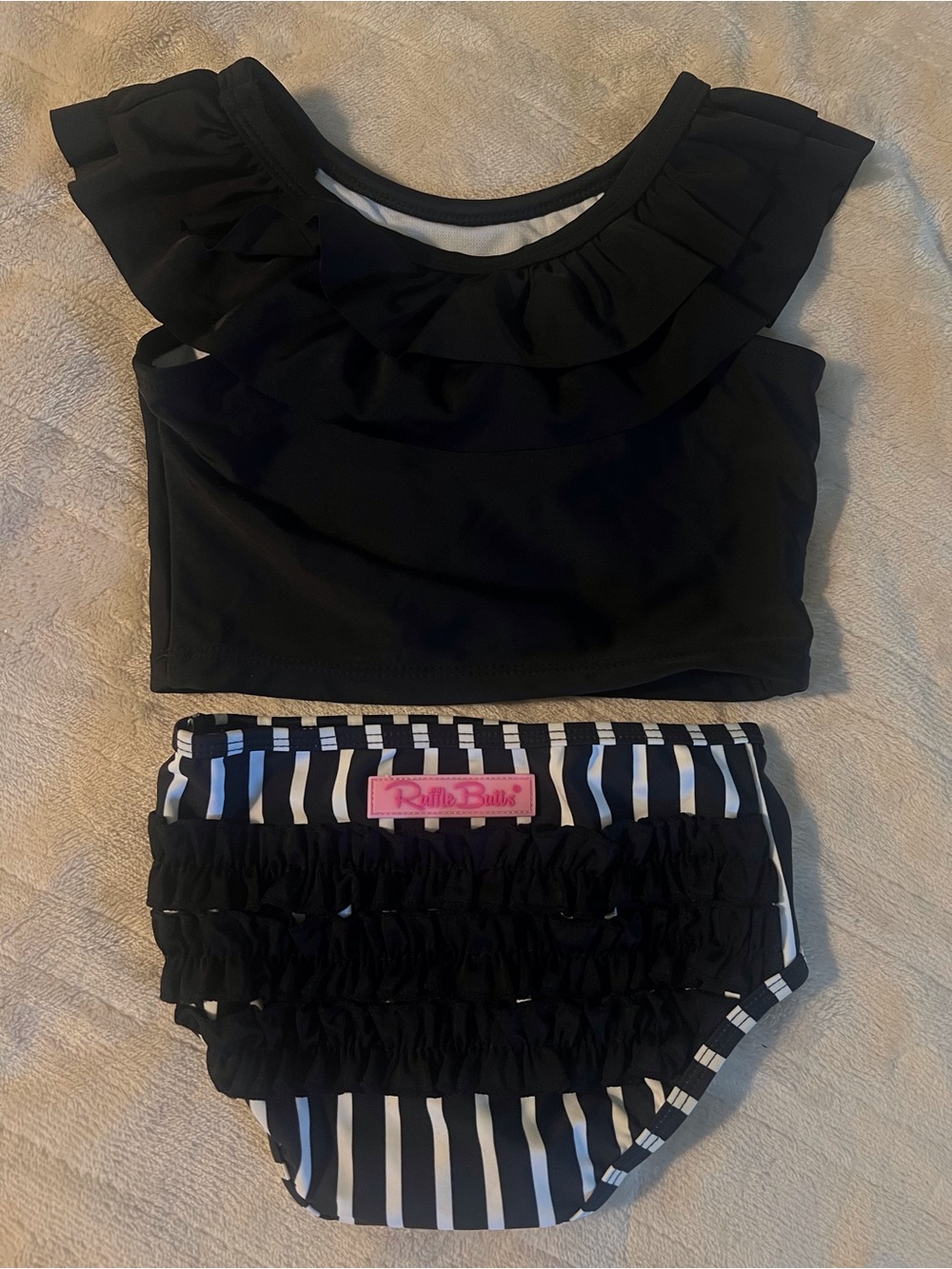 RuffleButts Black & White Striped Ruffled Swim Set with Pink Logo